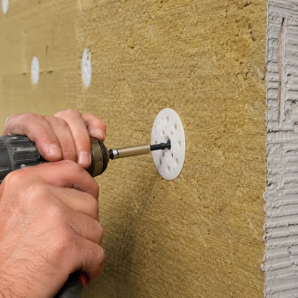 Mechanical fixing seated into an external wall insulation board