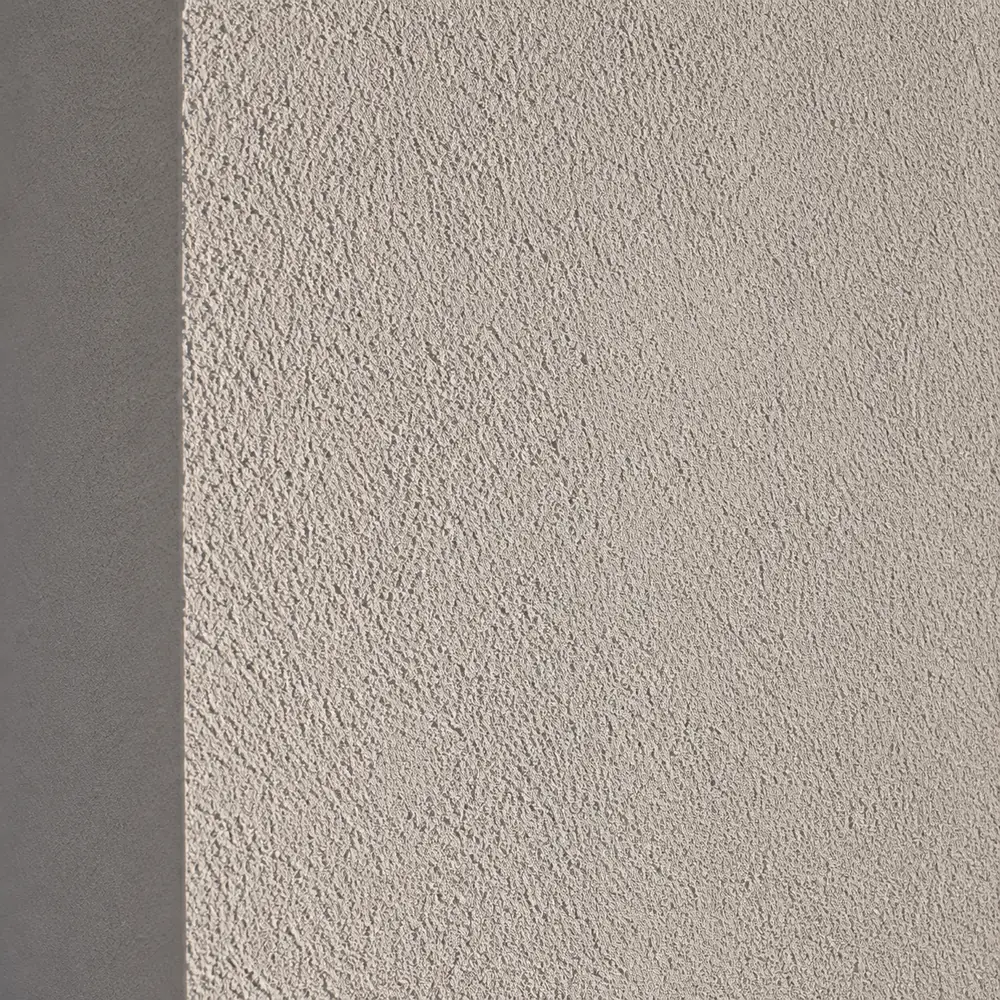 Finished external wall insulation render texture under raking light