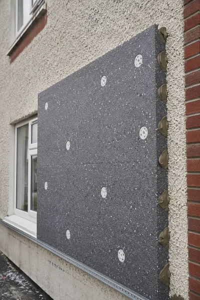 External wall insulation boards being fixed